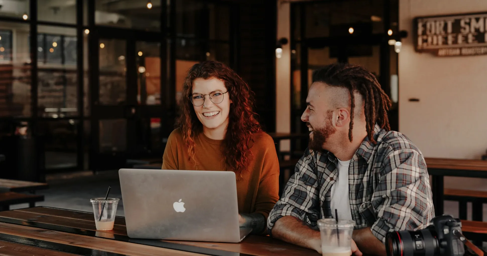 Image of two people reviewing information on a laptop